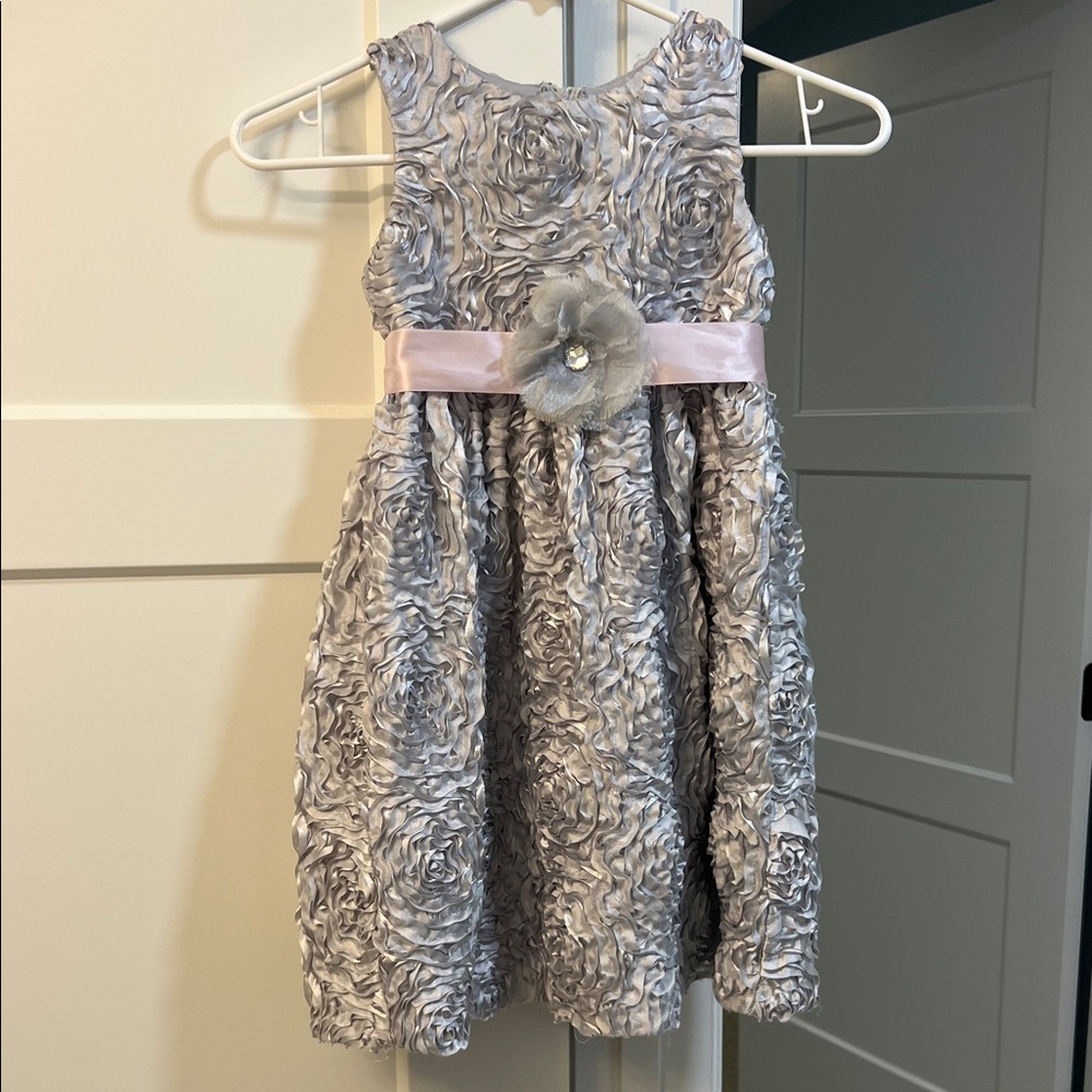 Fancy silver girls party dress with silver flower and pink ribbon